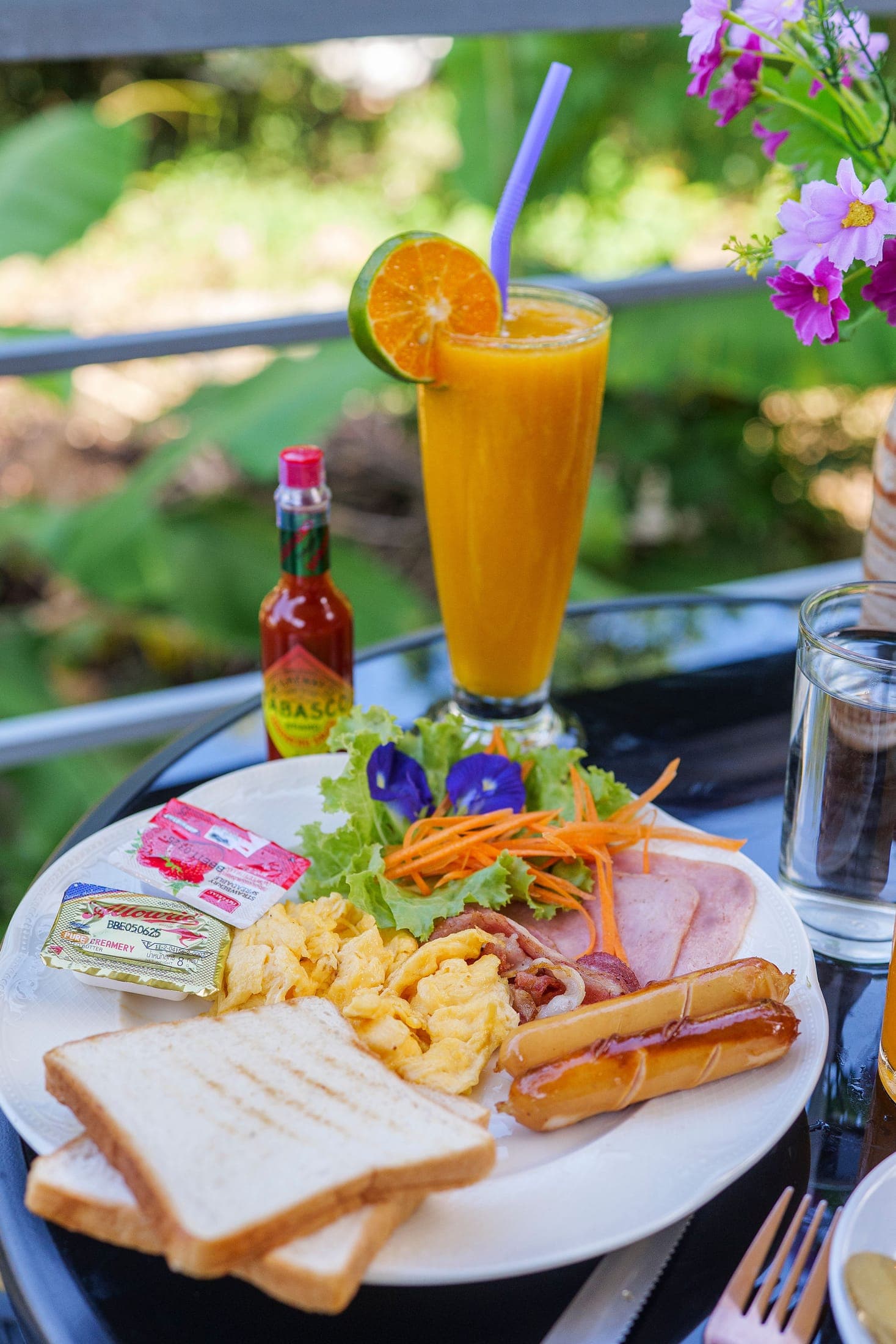 Breakfast with fresh juice on the bungalow balcony, Koh Chang